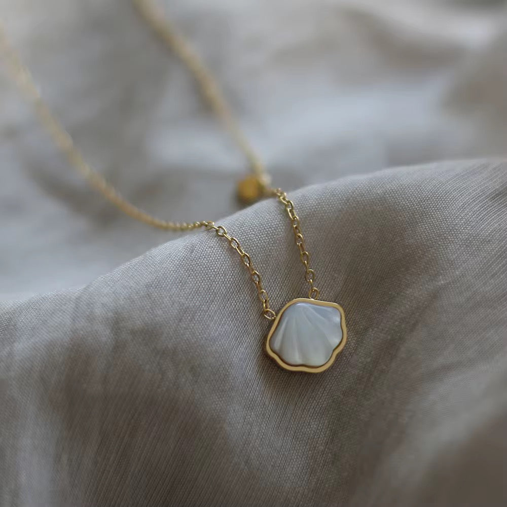 Necklace with a pendant on a soft fabric background