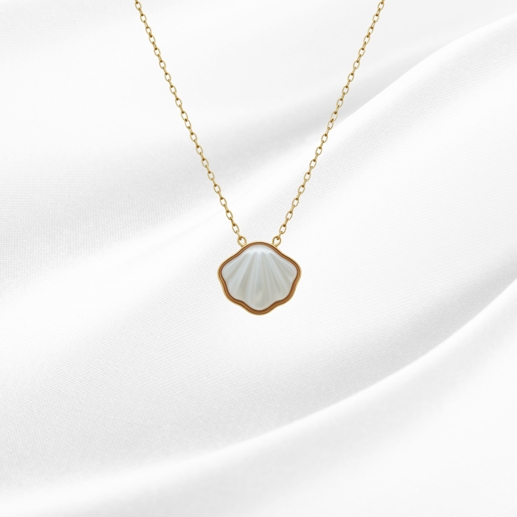 Necklace with a shell-shaped pendant on a white background