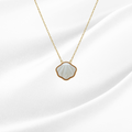 Necklace with a shell-shaped pendant on a white background