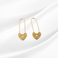 Gold heart-shaped lock earrings on a white background