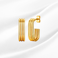 Gold hoop earrings on a white background