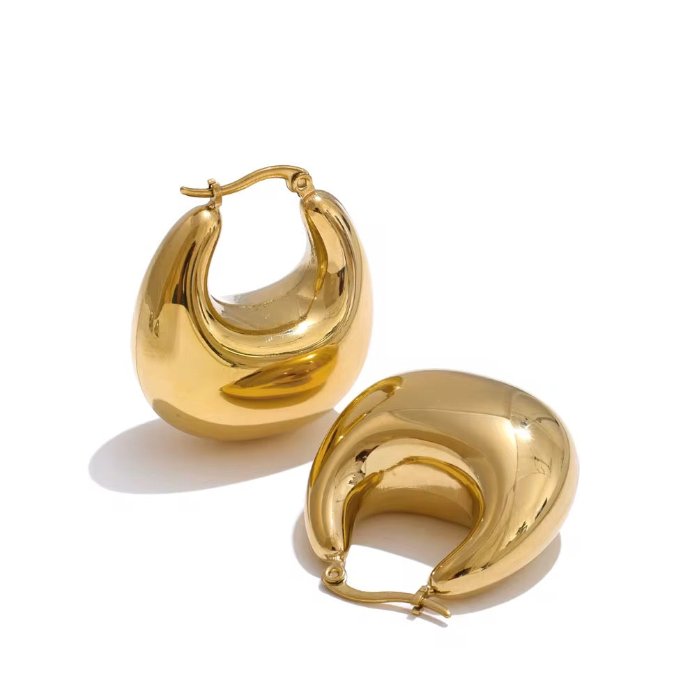 Gold hoop earrings on a white background