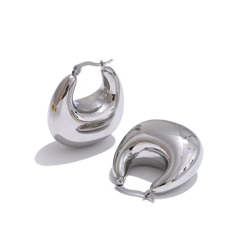 Pair of silver hoop earrings on a white background